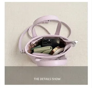 Interior view showing the large capacity and main compartment of the light purple bucket bag