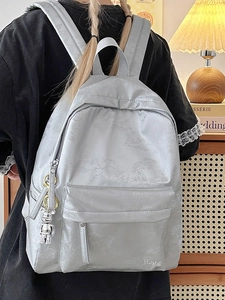 Soft light grey floral nylon backpack with a cute bear keychain charm for women
