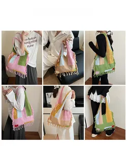 Detail of boho style colorful knit tote bag featuring fringe trims and multi-color patchwork