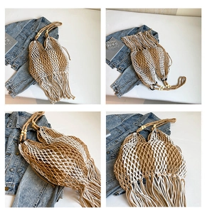 Detail view of hollow woven beach tote with long tassels and wooden bead handle