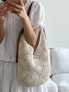 Chic sunflower crochet tote bag in beige with dark brown leather straps for beach holidays