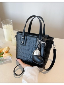 Elegant black crocodile texture bucket bag with heart charm and silver hardware