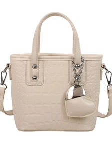 Elegant cream crocodile pattern bucket bag with heart charm and detachable strap