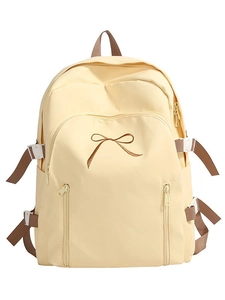 Sac à dos voyage minimaliste jaune crème avec broderie nœud marron et doubles fermetures