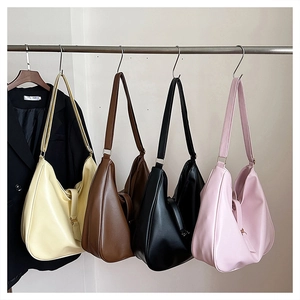 Selection of large faux leather tote bags in cream, brown, black, and pink colors