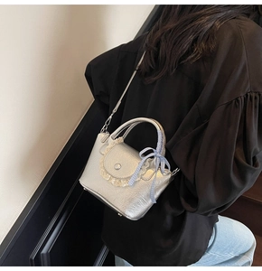 Silver pleated leather crossbody bucket bag with blue plaid bow and lace trim detail