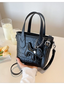 Vintage black crocodile embossed bucket bag with silver hardware and chic charm