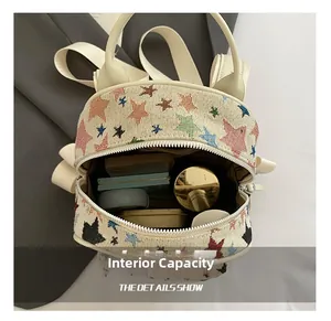 Detail show of star patterned backpack interior holding cosmetics and makeup essentials