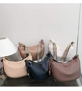 Detailed display of crescent hobo bags in five colors with woven jacquard wide straps