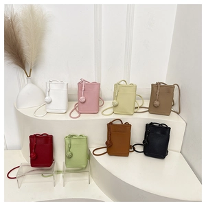 Detailed display of vertical mini crossbody phone bags in eight vibrant colors and textures
