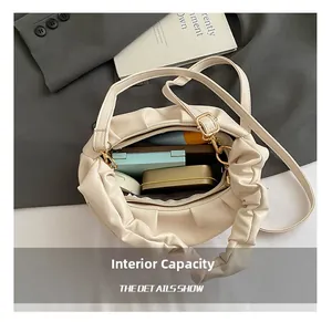 Internal capacity of the off-white cloud pleated bag holding cosmetics for daily use