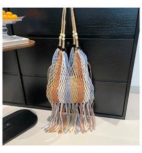 Detailed Macrame weave pattern with fringes and decorative beads on a handmade tote bag