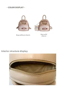 Detail of cute cat shaped mini backpack with smooth zipper and dark fabric inner lining