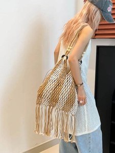 Bohemian handwoven fringe tote bag with wooden beads and tassels for beach vacations