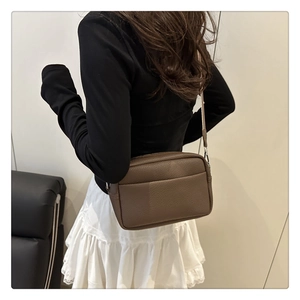 Rear view of brown lychee texture leather shoulder bag with back slip pocket detail