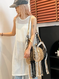 Bohemian oversized woven tote bag with fringe tassels and wooden beads on shoulder straps
