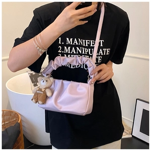 Detail of lilac ruched shoulder bag with cute teddy bear charm and soft cloud handle