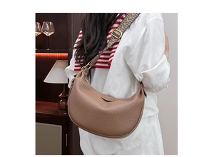 Brown lychee leather hobo bag featuring ethnic geometric woven strap and gold hardware