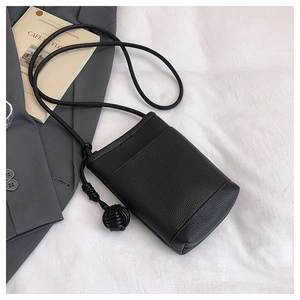 Detail of black litchi texture PU leather mini crossbody bag with round rope strap