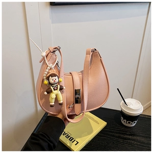Pink lychee grain leather crescent bag with pearl charm and silver lock detail