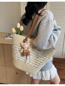 Summer straw woven tote bag with white hollow crochet and brown leather handles