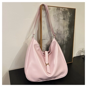 Detail view of pink large capacity PU leather hobo tote bag with decorative strap