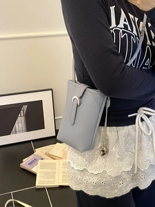 Chic grey-blue leather phone bucket bag with crescent moon buckle and thin strap