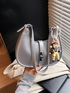 Chic silver lychee grain crossbody dumpling bag with cute doll pendant and metal lock