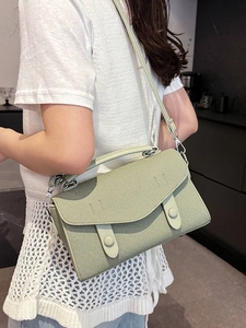 Pale green crossbody bag in woven texture with top handle and adjustable strap for women