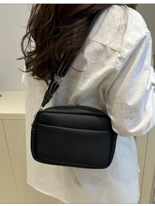 Women's black pebble grain PU crossbody bag with adjustable wide nylon shoulder strap