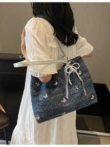 Deep blue denim tote bag with white polka dots and 3D metallic butterfly accents