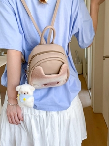 Cute beige cartoon cat mini backpack with bear pendant and adjustable straps for women