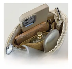 Macro view of the quilted leather bag interior showing high storage capacity and pocket