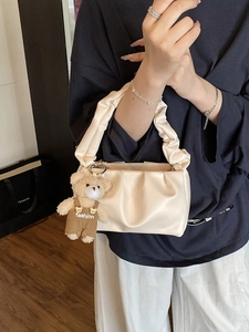 Chic cream ruched shoulder bag with a cute teddy bear pendant for women's daily commute