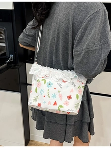 Floral canvas crossbody bag with white lace trim and colorful heart prints for women