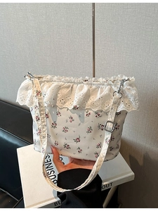 Floral print shoulder bag with delicate white lace trim and adjustable strap for women