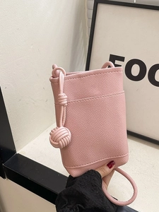 Pink lychee texture mini crossbody bucket bag for women with woven ball charm detail