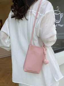 Pink lychee texture crossbody phone bag for women with decorative sphere knot strap