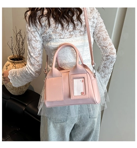 Pink patent leather Boston bag shown on model highlighting daily wear and size