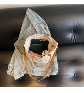 Interior view of canvas tote bag showing large capacity for tablet and daily items