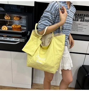 Detail of yellow Beyond Hemu tote bag set with textured fabric in a modern kitchen setting