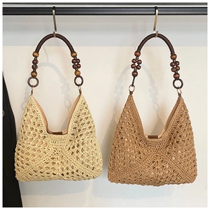 Detail of bohemian woven tote bags with geometric crochet patterns and wooden bead handles