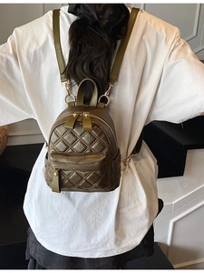 Olive green quilted mini backpack in glossy PU leather with elegant golden hardware details