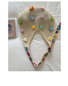 Detailed close-up of cream crochet tote bag with colorful 3D floral embroidery and wide straps