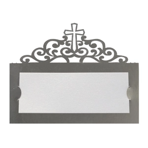 Close-up of laser-cut cross pattern wedding place card with blank insert on white background