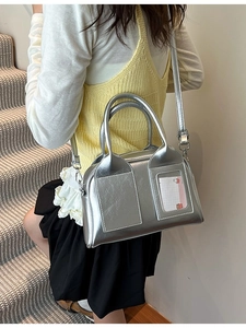 Retro silver metallic Boston bag with wrinkled texture and stylish crossbody strap
