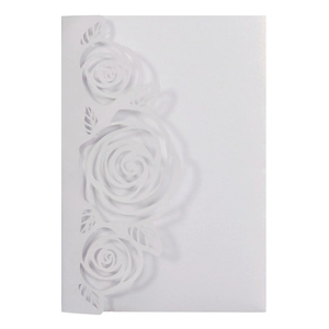 Detailed laser-cut rose patterns on elegant white pearlescent invitation card cover