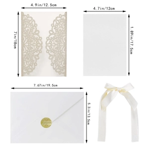 Detail view of laser-cut wedding invitation kit with envelope, ribbon and size guide