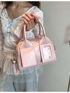 Retro cherry pink shiny leather Boston bag with dual handles and crossbody strap