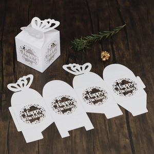 Macro view of white laser cut cardstock gift box with 3D butterfly and Happy Birthday text